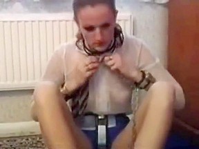Girl putting on chastity belt and steel shackles – FreePron.Org